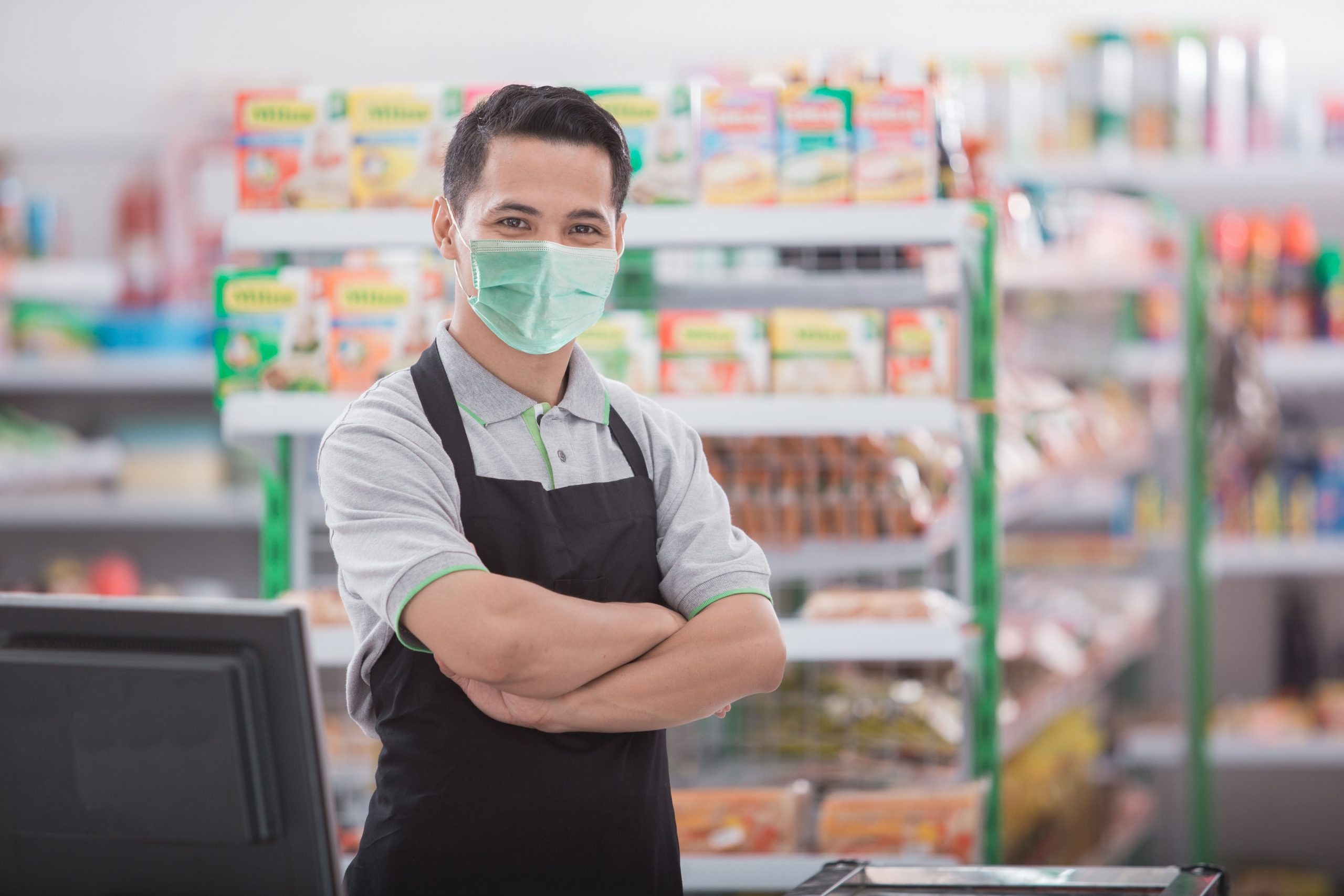 happy asian male shopkeeper